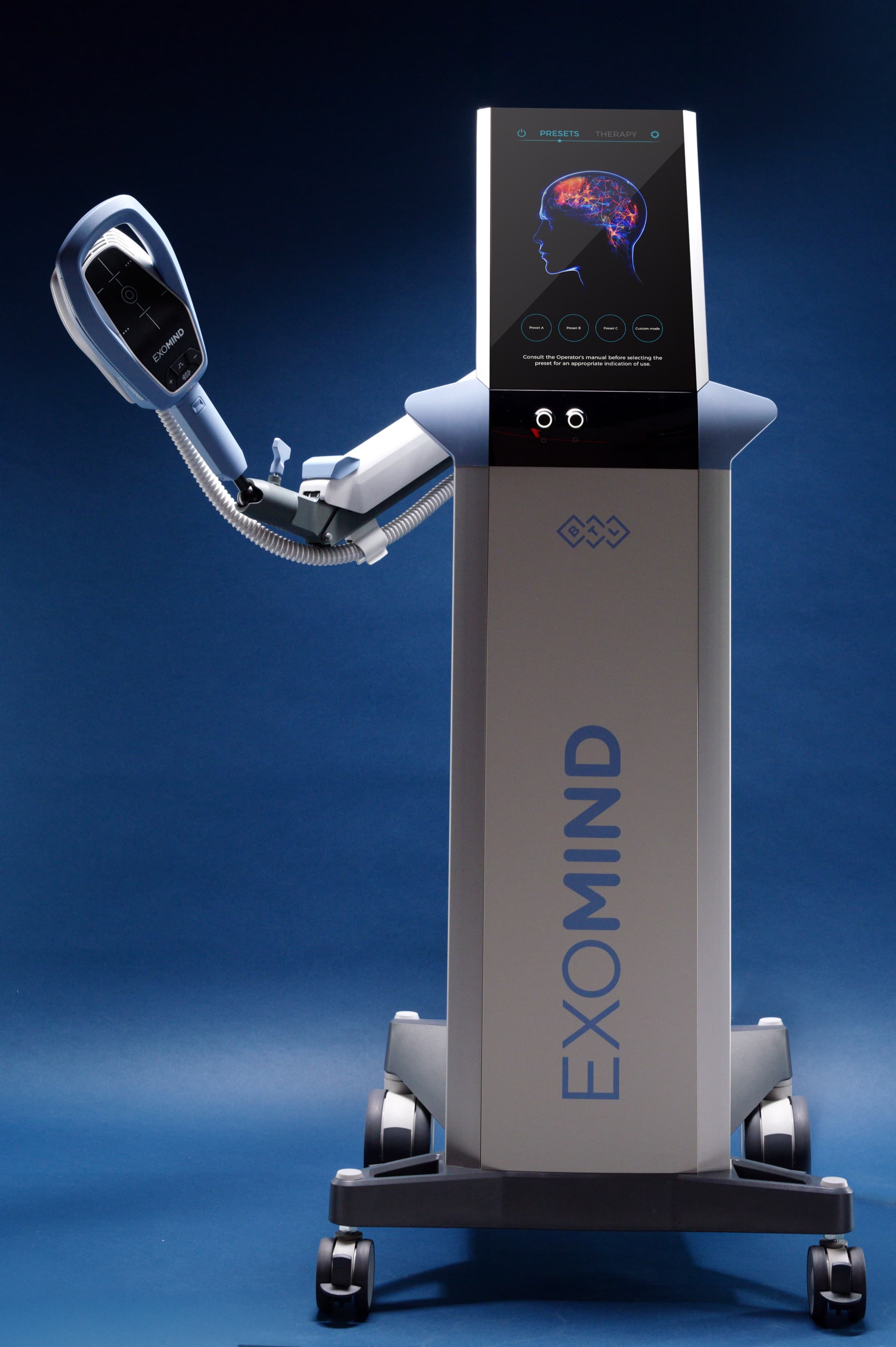 The EXOMIND treatment device on its mobile stand, ready for a session.